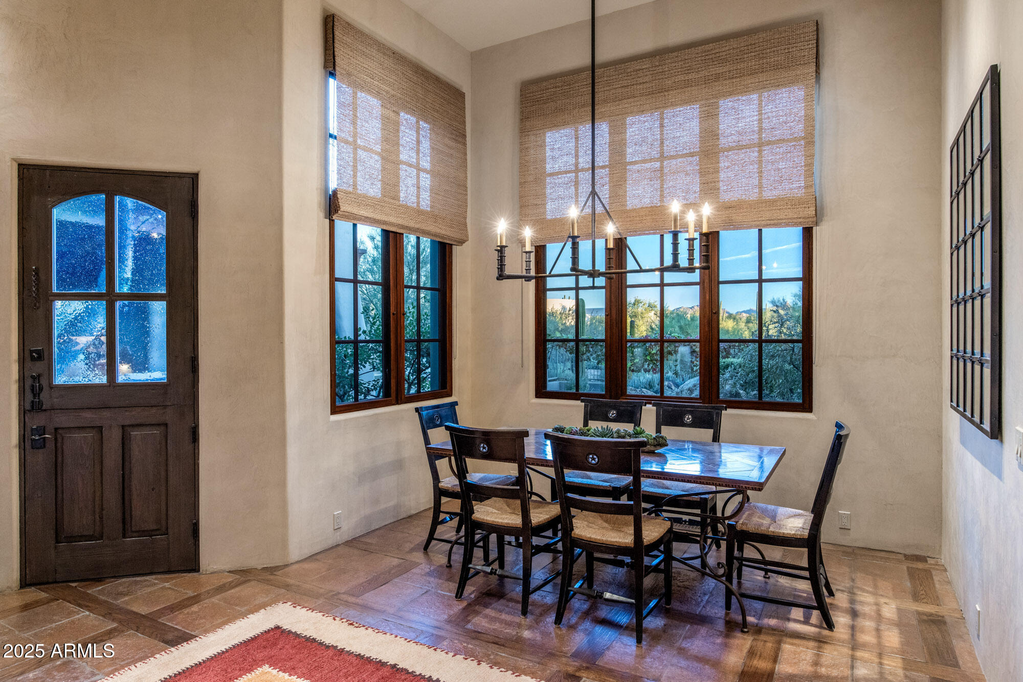 8300 East Dixileta Drive, Unit 211 Scottsdale, AZ 85266 - Photo 12 of 35 a view of a dining room with furniture and windows