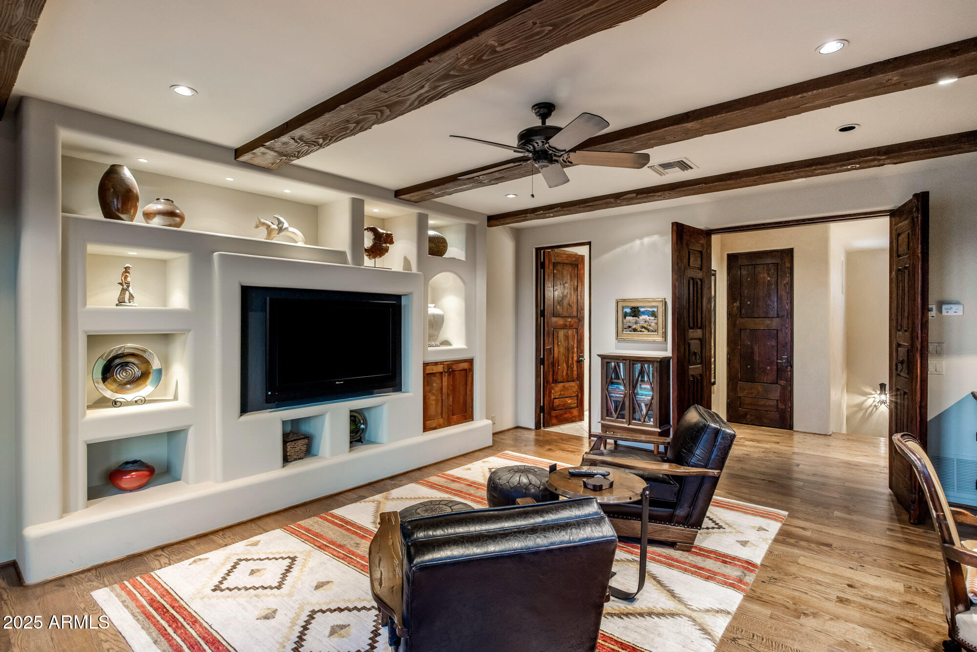 8300 East Dixileta Drive, Unit 211 Scottsdale, AZ 85266 - Photo 16 of 35 a living room with furniture and a flat screen tv