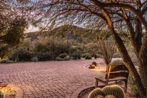 a living room with furniture fireplace and book shelf