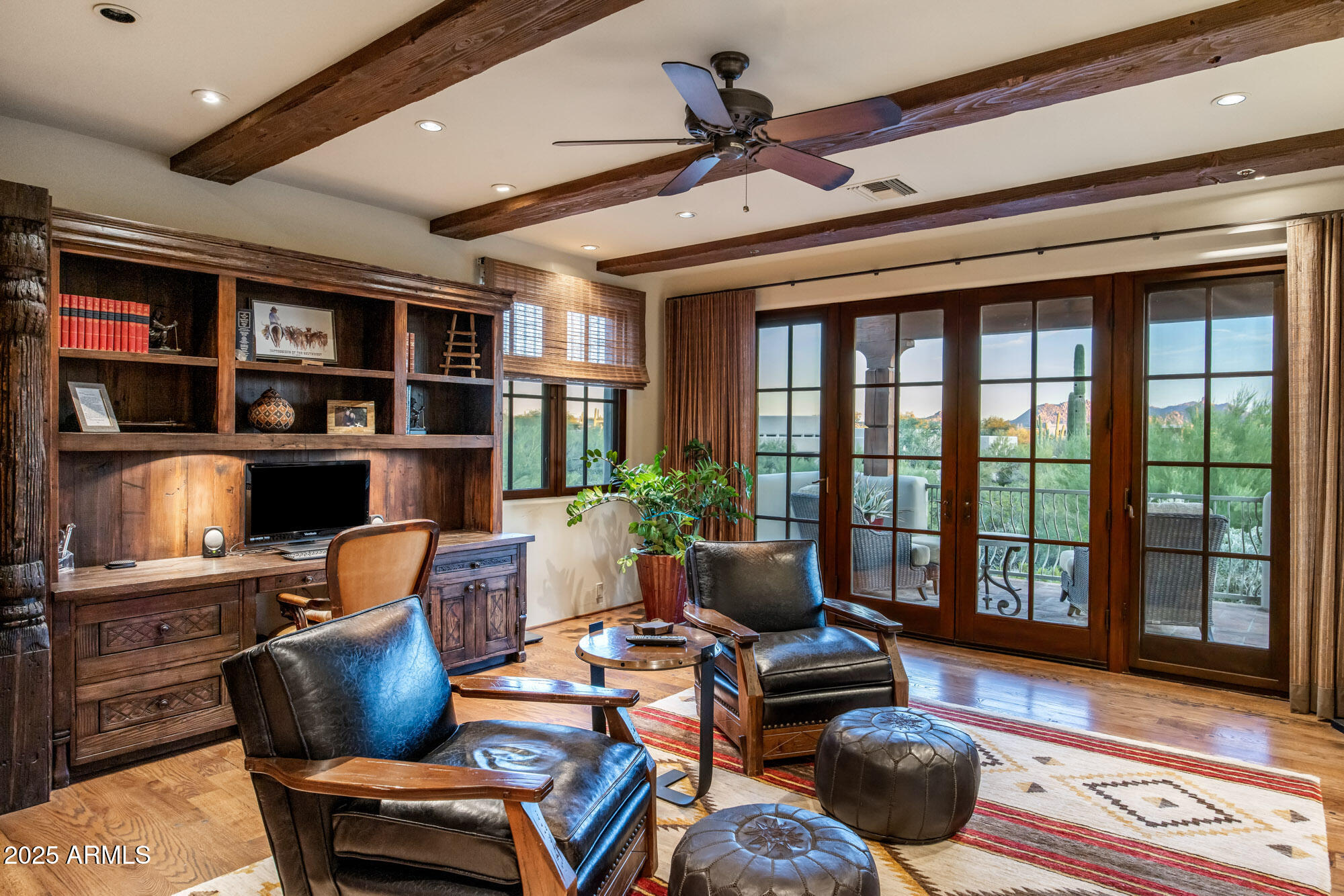 8300 East Dixileta Drive, Unit 211 Scottsdale, AZ 85266 - Photo 18 of 35 a living room with furniture fireplace and book shelf