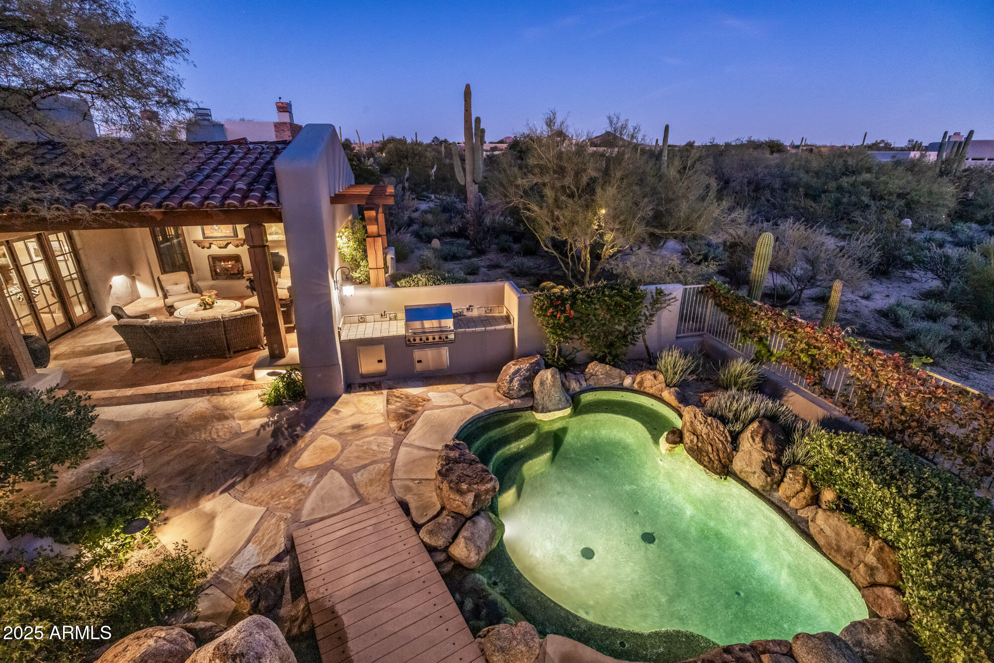 8300 East Dixileta Drive, Unit 211 Scottsdale, AZ 85266 - Photo 20 of 35 a backyard of a house with yard and outdoor seating