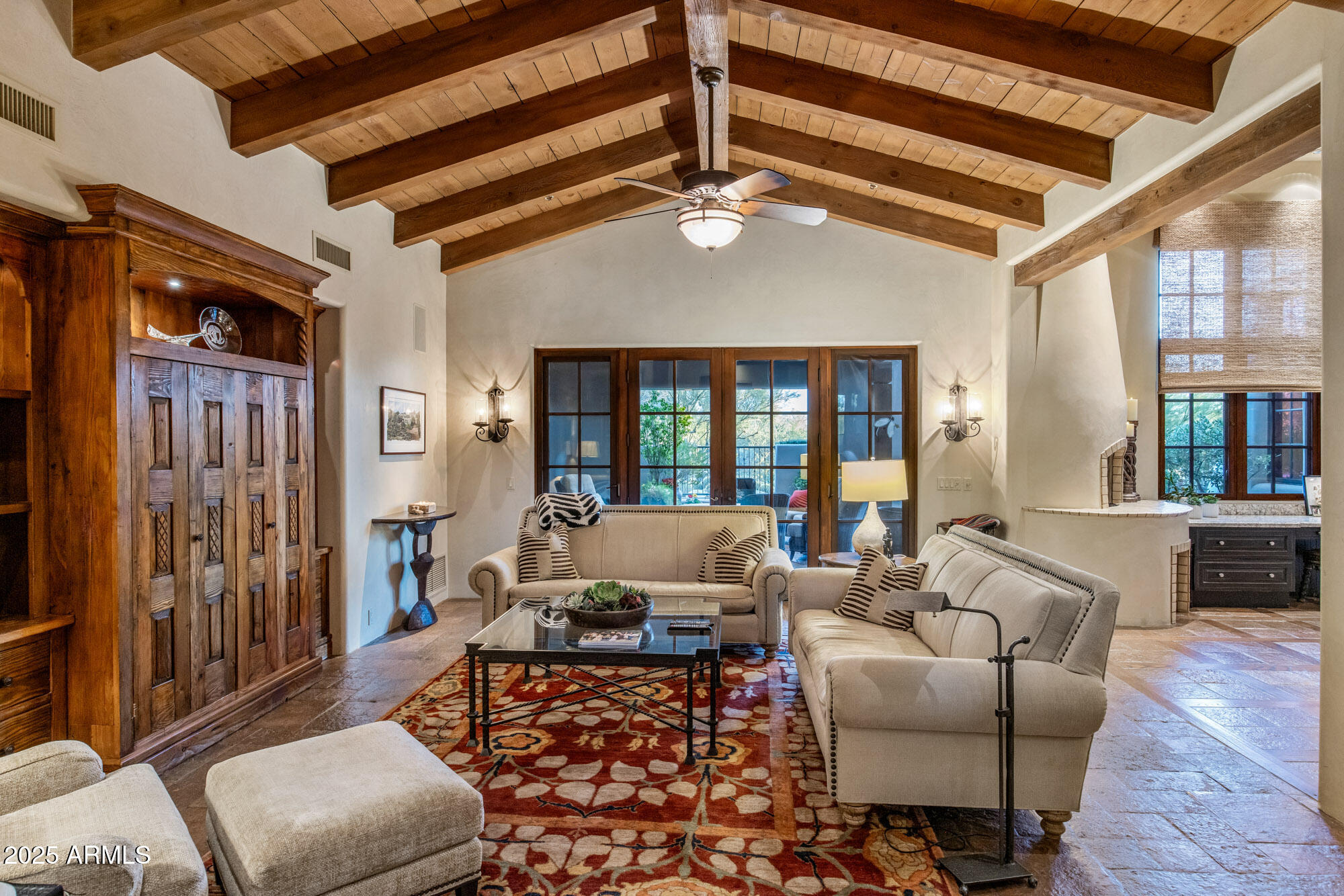 8300 East Dixileta Drive, Unit 211 Scottsdale, AZ 85266 - Photo 24 of 35 a living room with furniture and a chandelier