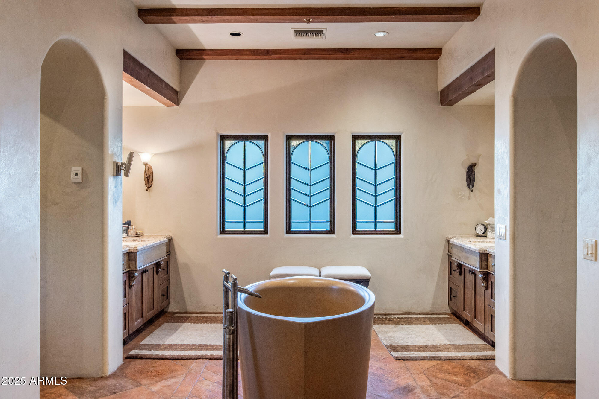 8300 East Dixileta Drive, Unit 211 Scottsdale, AZ 85266 - Photo 26 of 35 a bathroom with a sink and a mirror