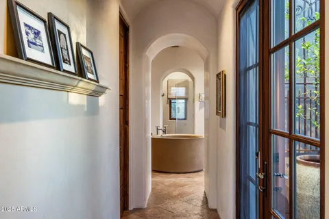 a bedroom with furniture and a window