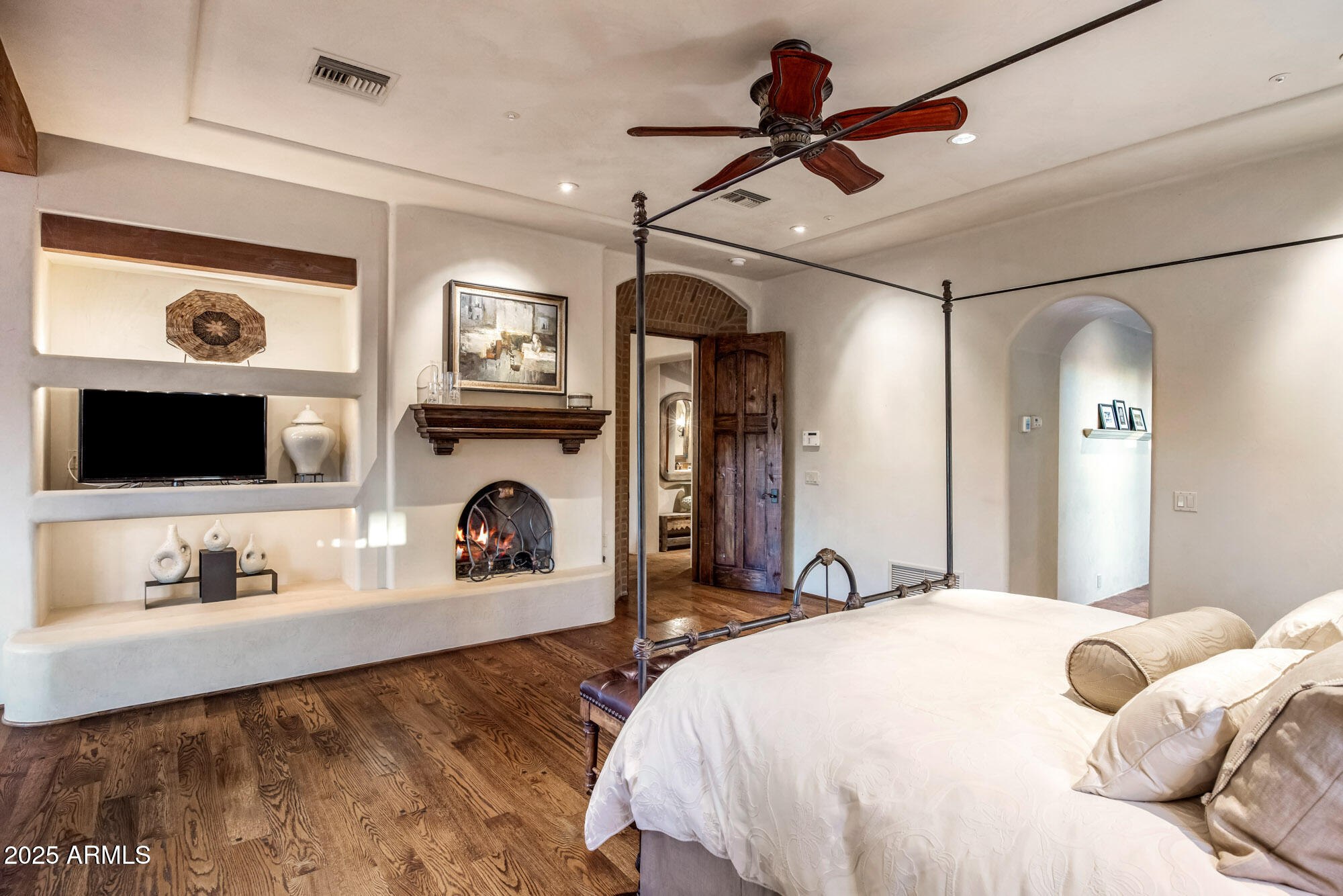 8300 East Dixileta Drive, Unit 211 Scottsdale, AZ 85266 - Photo 29 of 35 a bedroom with a bed and a flat screen tv