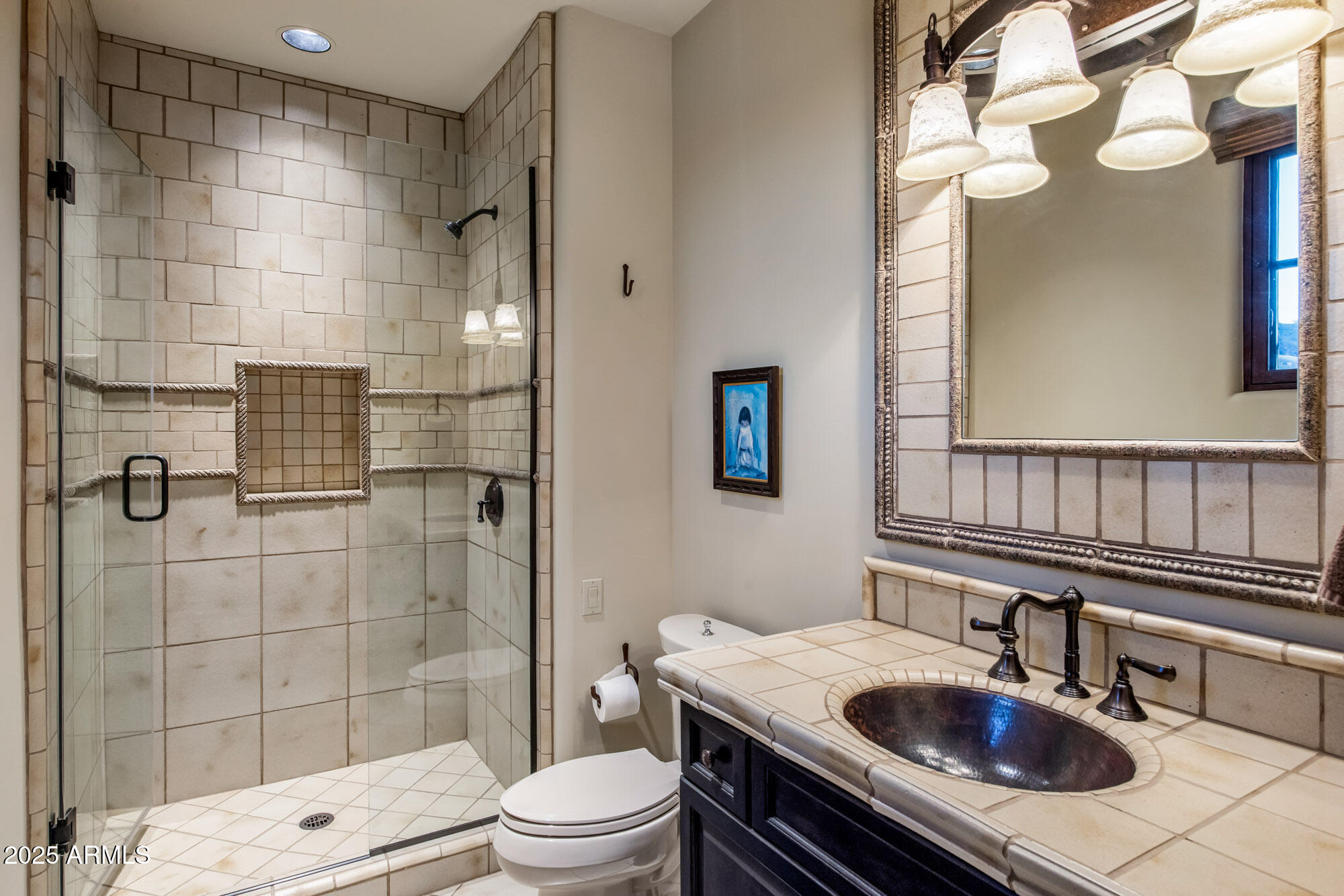 8300 East Dixileta Drive, Unit 211 Scottsdale, AZ 85266 - Photo 9 of 35 a bathroom with a sink a toilet and shower