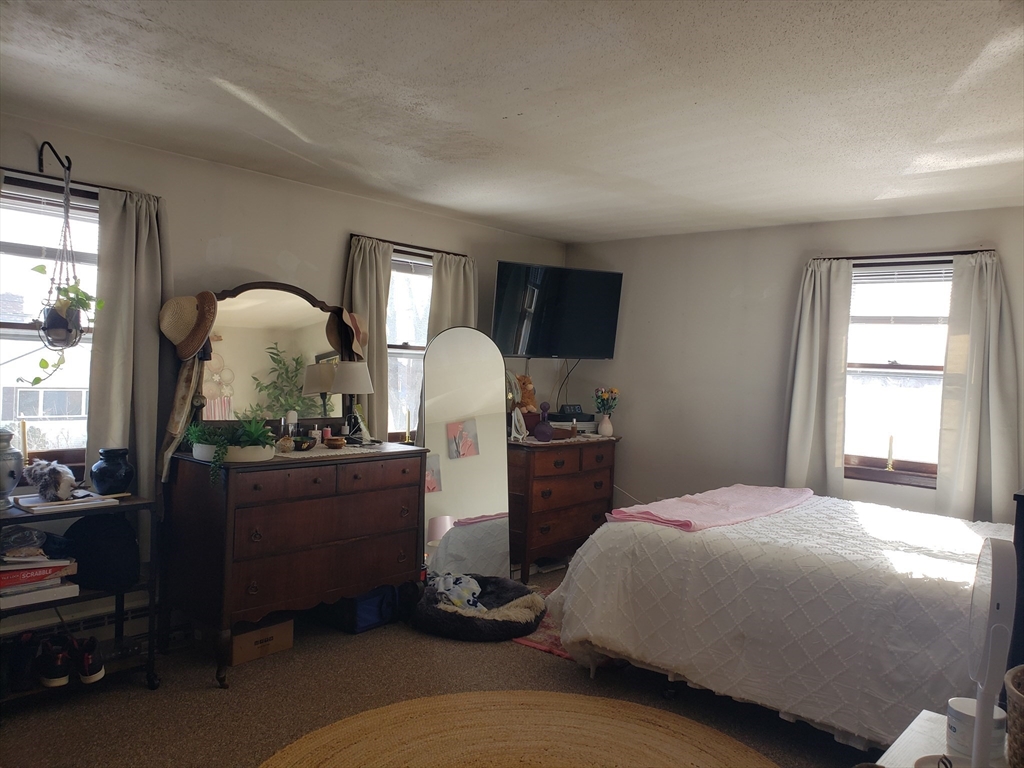 81-83 Motyka Street Ludlow, MA 01056 - Photo 13 of 20 a bed room with furniture and a window