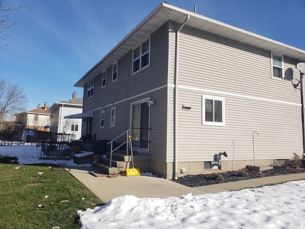 81-83 Motyka Street Ludlow, MA 01056 - Photo 19 of 20 a view of a house with snow on roof