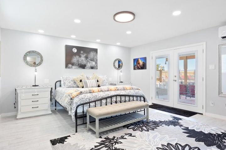 69450 Amboy Road Twentynine Palms, CA 92277 - Photo 13 of 46 a bedroom with a bed and a painting on the wall