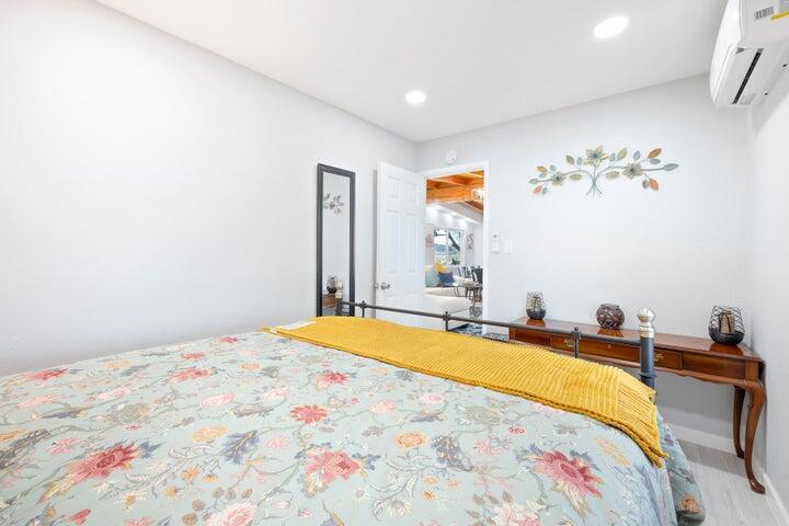 69450 Amboy Road Twentynine Palms, CA 92277 - Photo 19 of 46 a bedroom with a bed and a chandelier