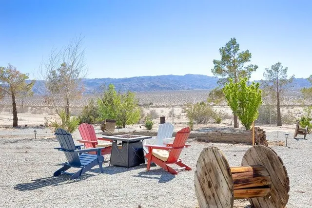 a view of a patio with a table and chairs