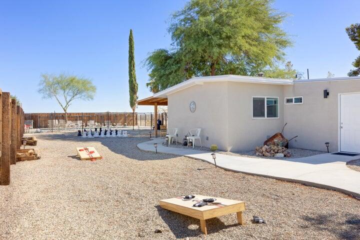 69450 Amboy Road Twentynine Palms, CA 92277 - Photo 45 of 46 a swimming pool with outdoor seating and yard