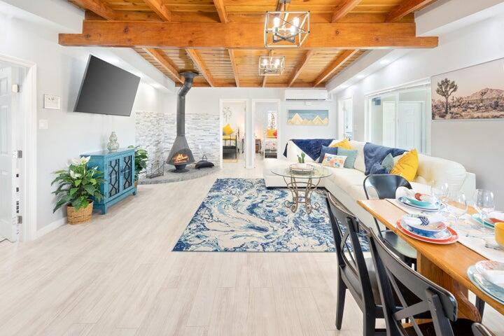 69450 Amboy Road Twentynine Palms, CA 92277 - Photo 8 of 46 a living room with furniture and a flat screen tv