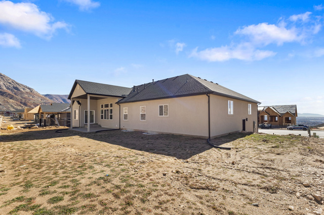 638 East Mountain Road North Ogden, UT 84414 - Photo 28 of 28 Back of house featuring a mountain view, a patio, and a shingled roof
