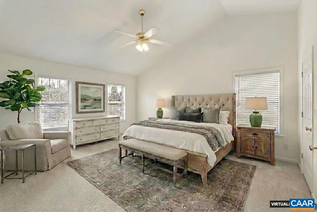 a bed room with a bed and a chair