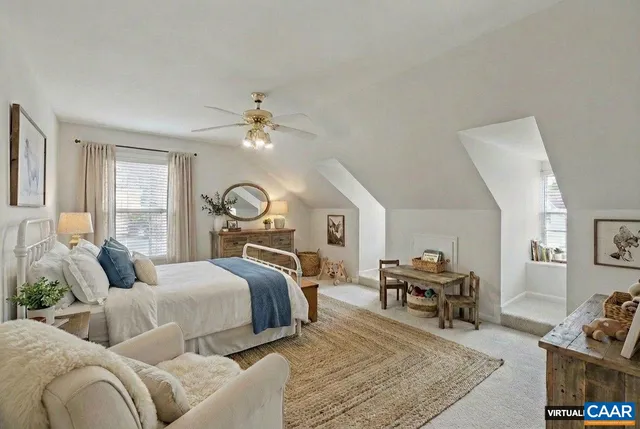 a bedroom with furniture and a chandelier