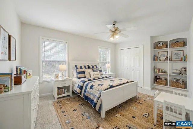 a bed room with a bed and a book shelf