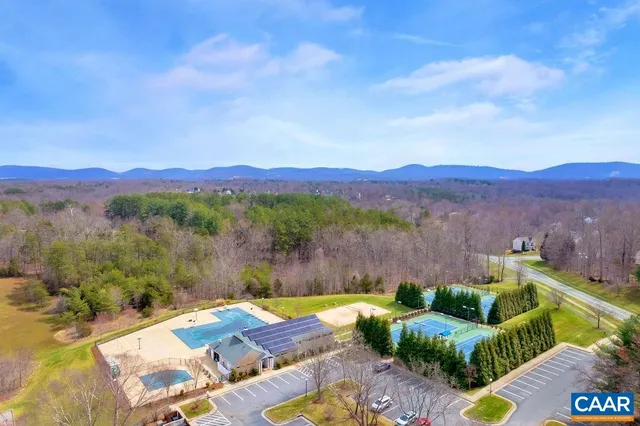a view of swimming pool with lake view and mountain view