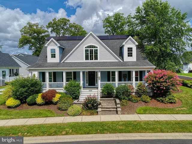 an aerial view of a house with outdoor space swimming pool and outdoor seating