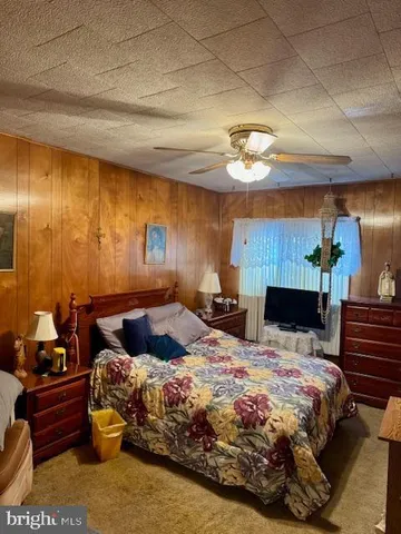 a bedroom with a bed and a lamp