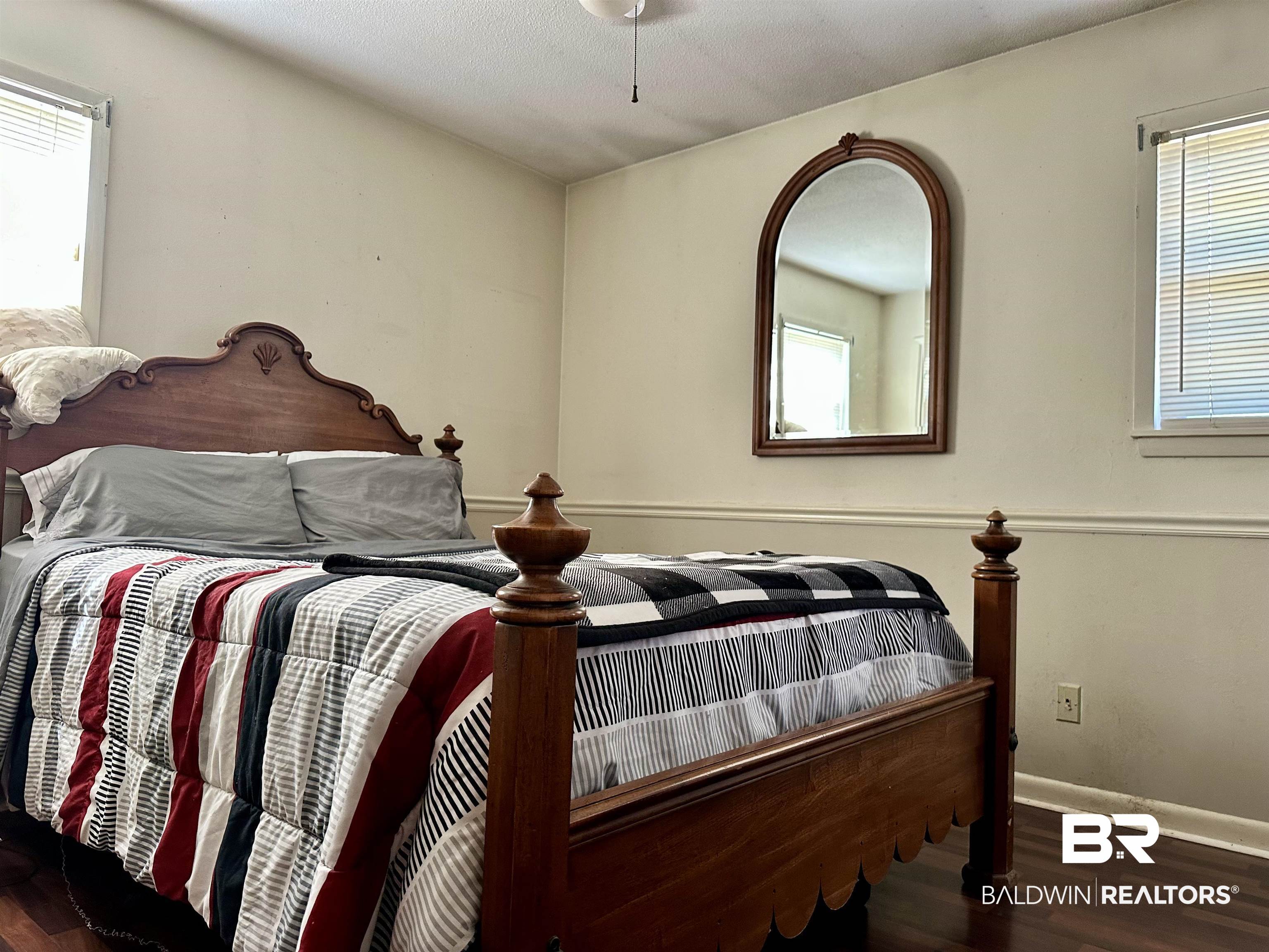 2593 Foshee Road Brewton, AL 36426 - Photo 7 of 15 Bedroom featuring dark wood-type flooring
