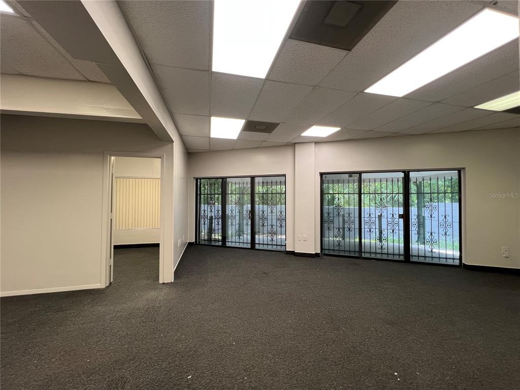 1173 Spring Centre S Boulevard, Unit A Altamonte Springs, FL 32714 - Photo 10 of 15 a view of an empty room with a fireplace and a window