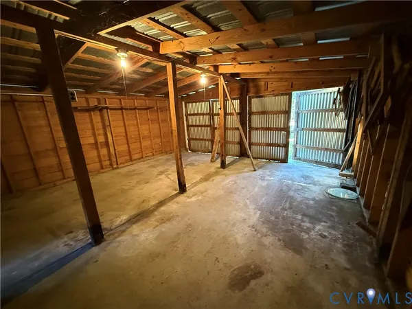 a view of empty room with wooden walls