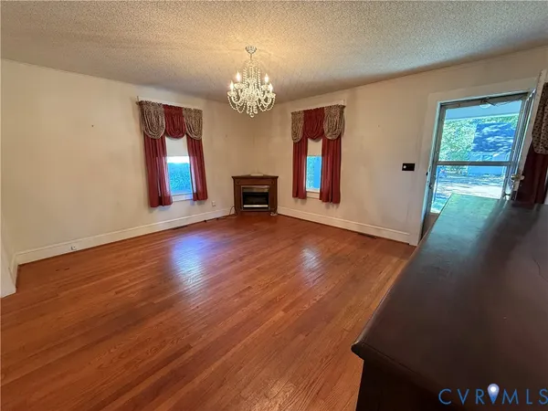 a view of a livingroom with wooden floor