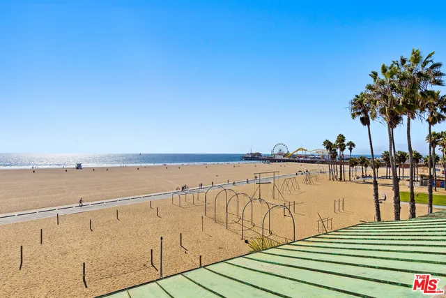 a group of people sitting in front of a building