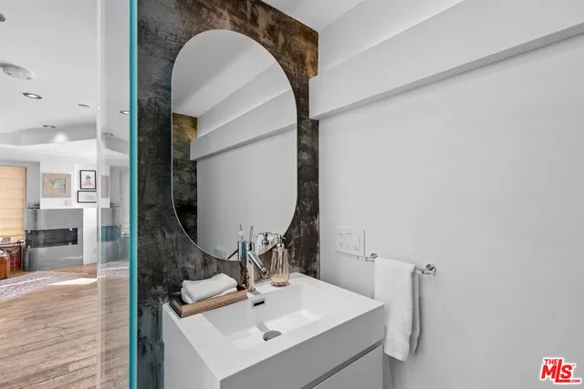 a bathroom with a sink and a mirror