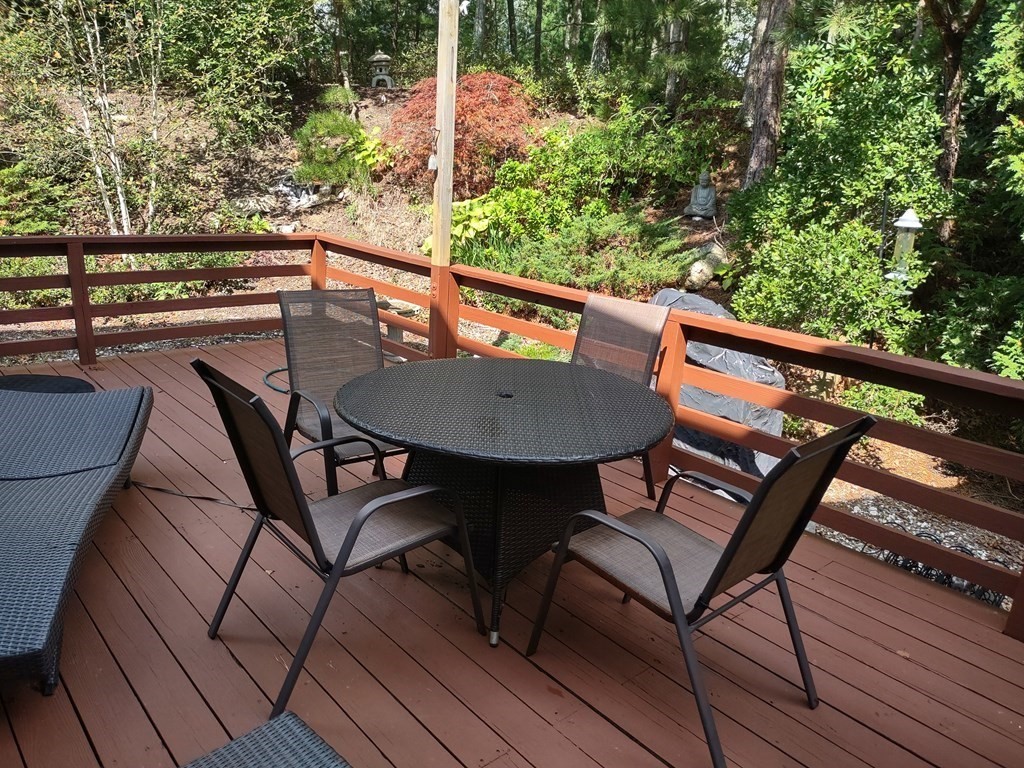 62 Round House Road, Unit 62 Bourne, MA 02532 - Photo 2 of 10 a view of a chairs and table on the deck