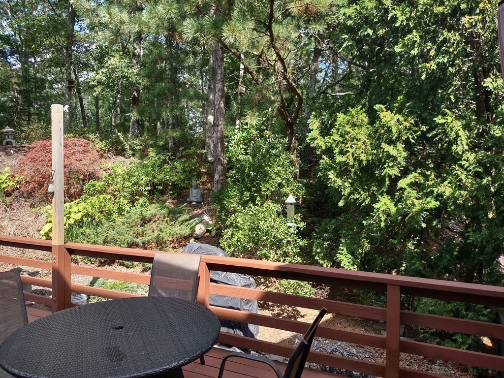 62 Round House Road, Unit 62 Bourne, MA 02532 - Photo 3 of 10 a view of a balcony with chairs