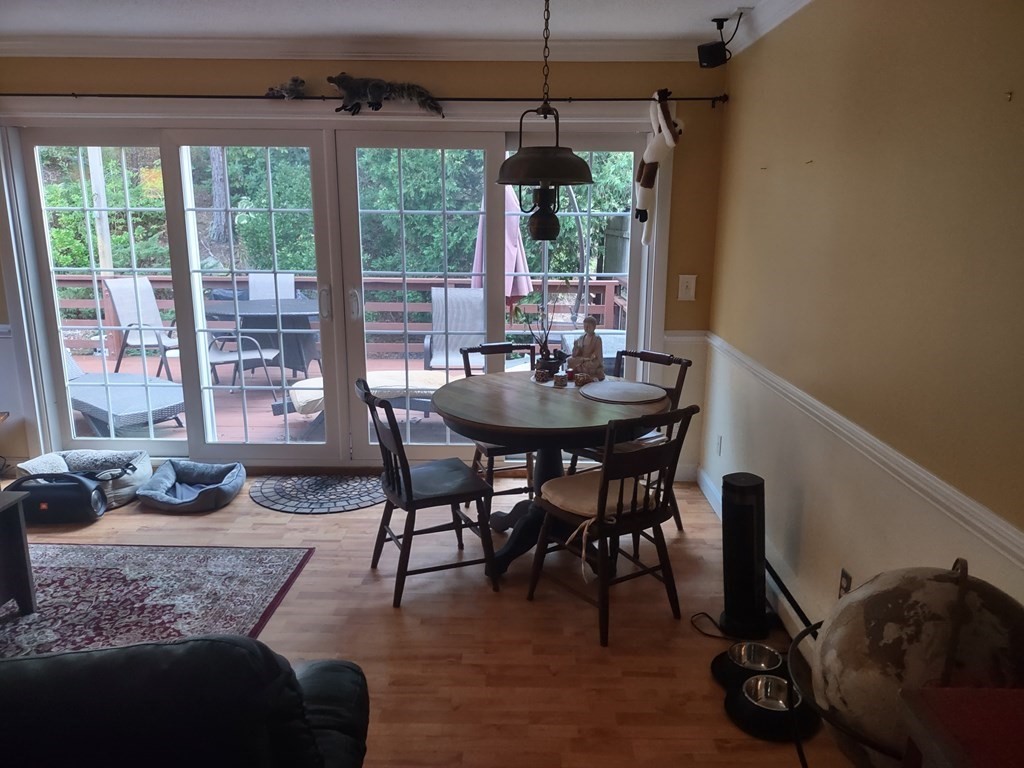 62 Round House Road, Unit 62 Bourne, MA 02532 - Photo 5 of 10 a view of a dining room with furniture window and outside view