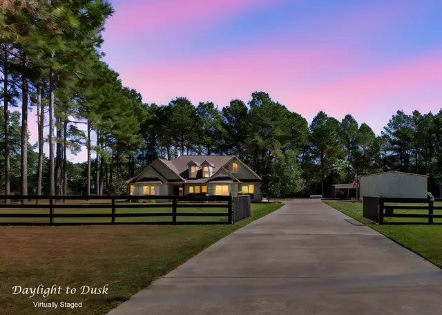 a park view with a bench in front of house