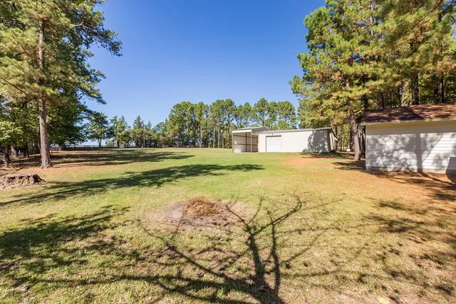 a view of a swimming pool with an outdoor space and seating area