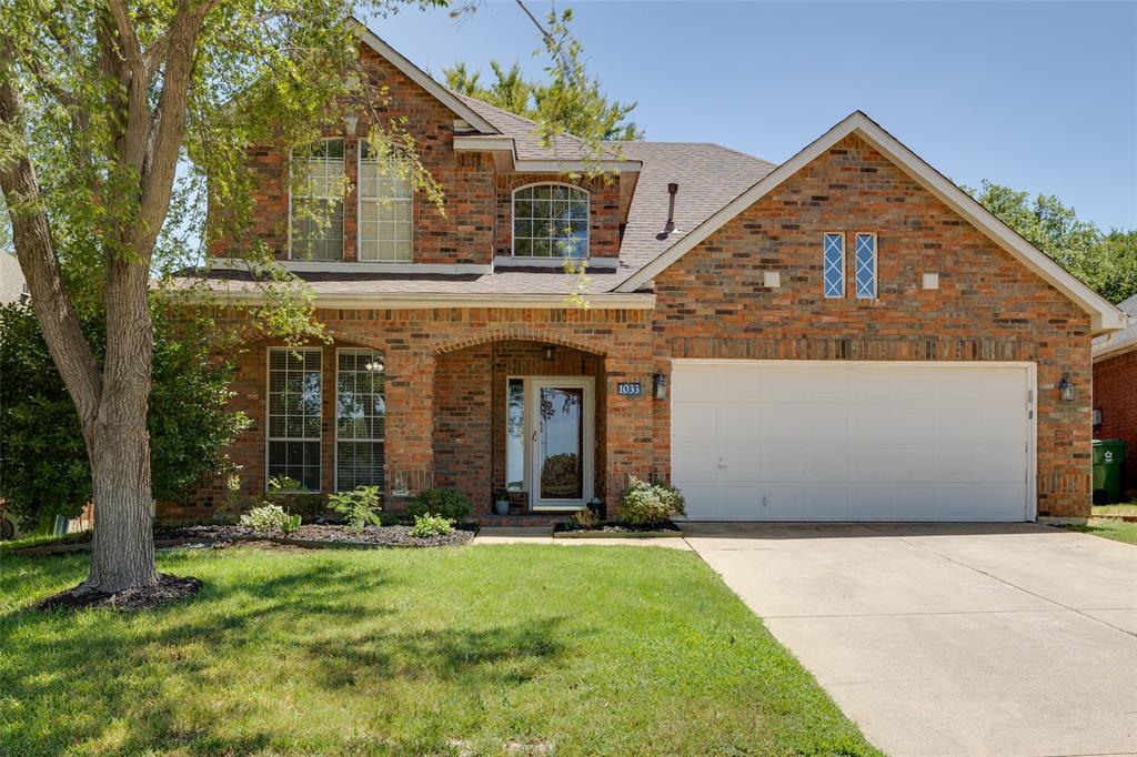1033 Sun Ridge Drive Flower Mound, TX 75028 - Photo 1 of 1 front view of a house with a yard
