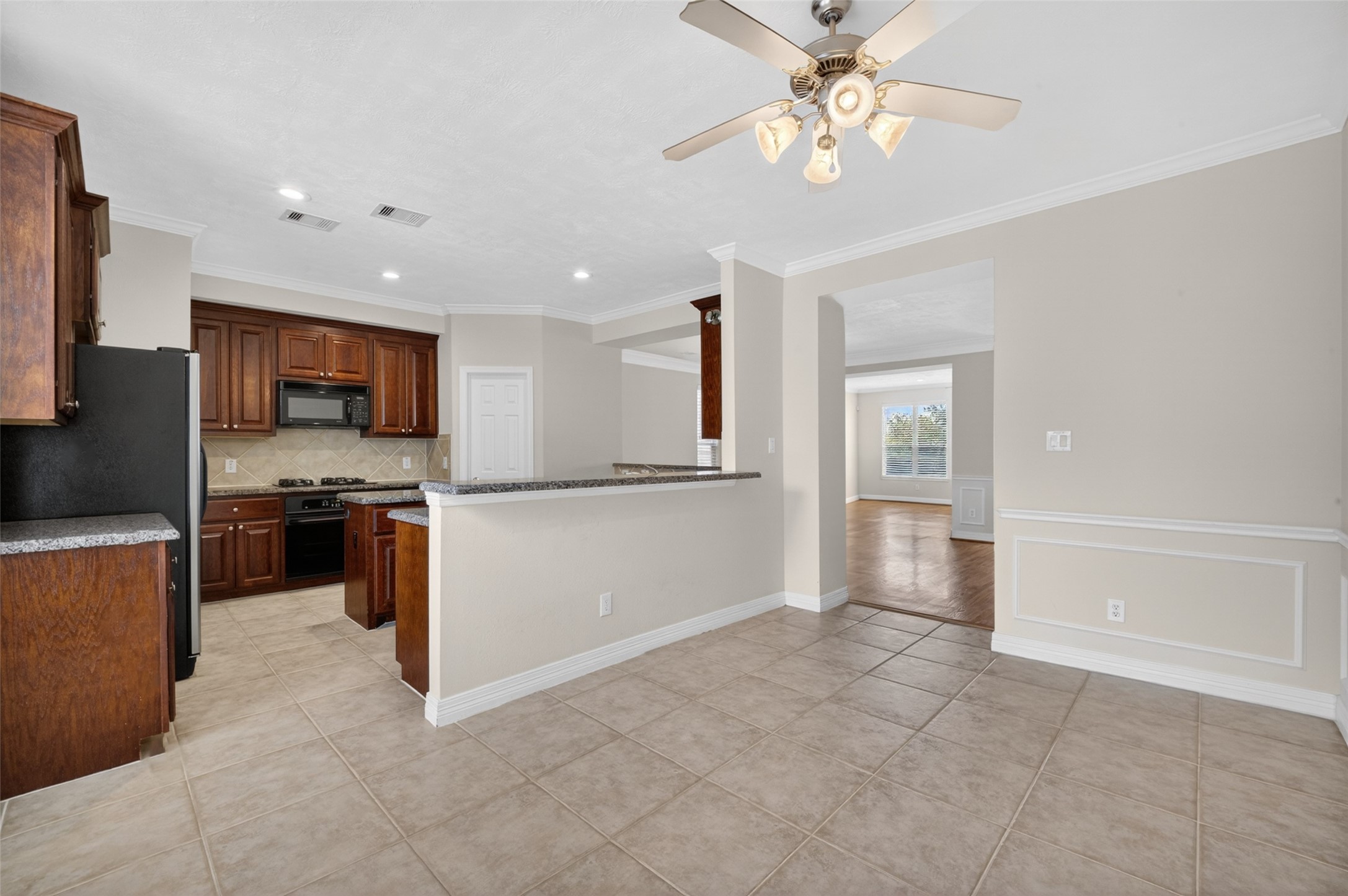 1807 Stacy Crest Houston, TX 77008 - Photo 14 of 35 a view of kitchen with microwave and refrigerator