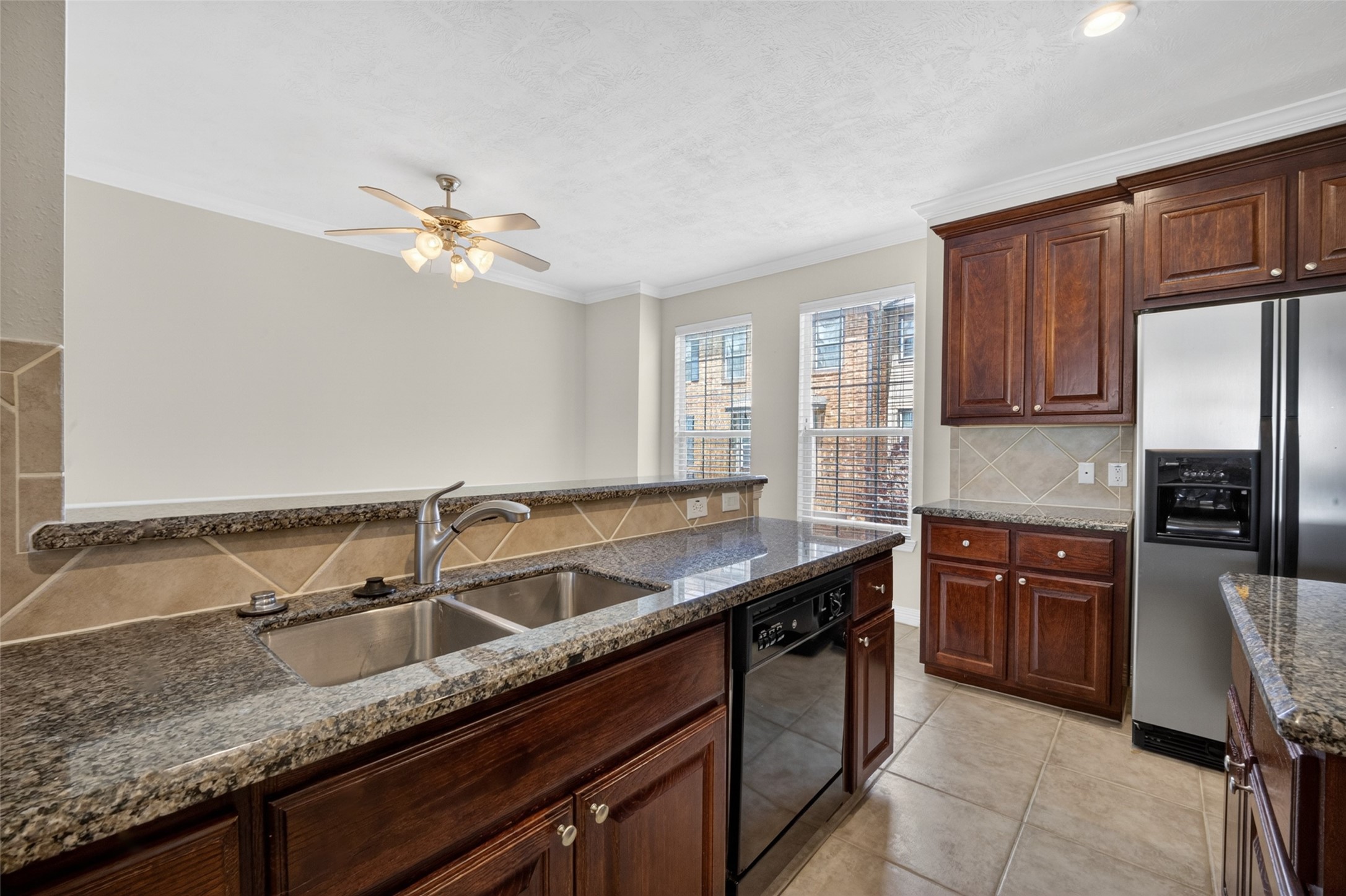 1807 Stacy Crest Houston, TX 77008 - Photo 16 of 35 a kitchen with stainless steel appliances granite countertop a sink a stove and a refrigerator