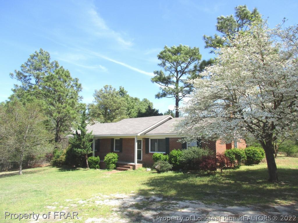 2181 Tingen Road Lillington, NC 27546 - Photo 4 of 36 a view of a house with a yard