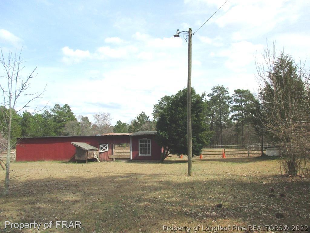 2181 Tingen Road Lillington, NC 27546 - Photo 8 of 36 a view of a house with a yard