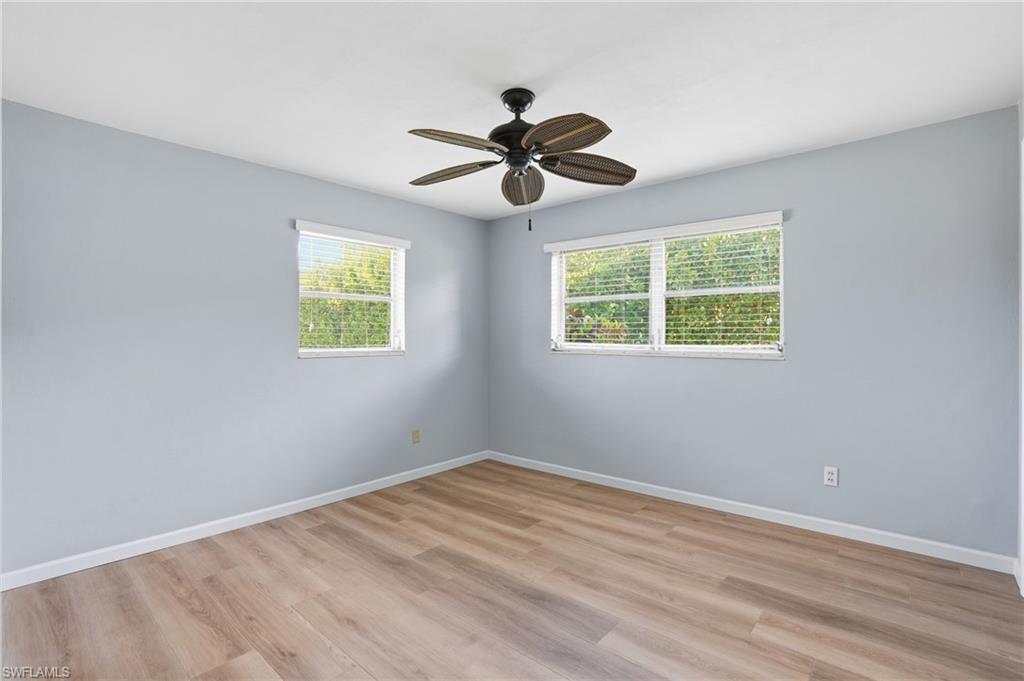 169 Viking Way Naples, FL 34110 - Photo 20 of 34 a view of empty room with window and ceiling fan