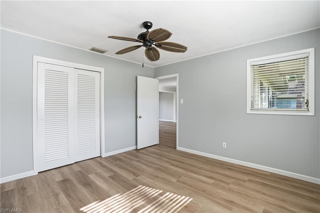 169 Viking Way Naples, FL 34110 - Photo 21 of 34 a view of an empty room with a window