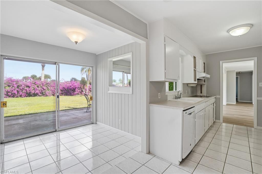 169 Viking Way Naples, FL 34110 - Photo 24 of 34 a large kitchen with white cabinets