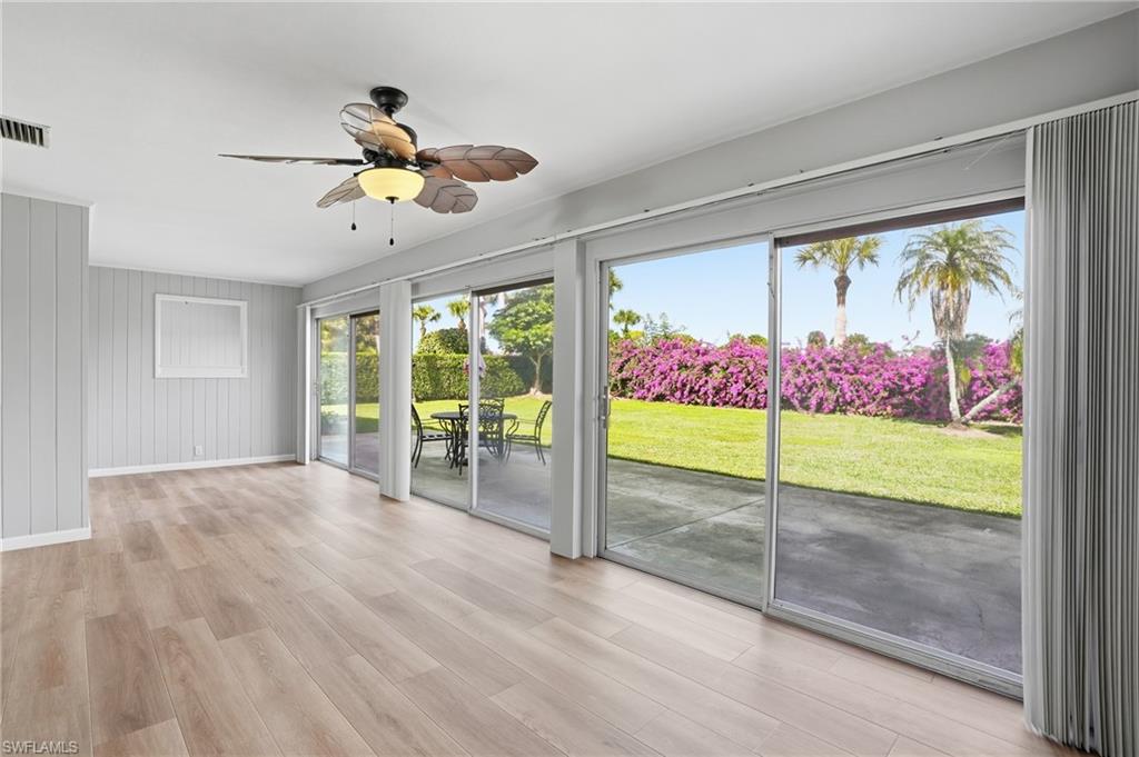 169 Viking Way Naples, FL 34110 - Photo 26 of 34 a view of an entryway with wooden floor
