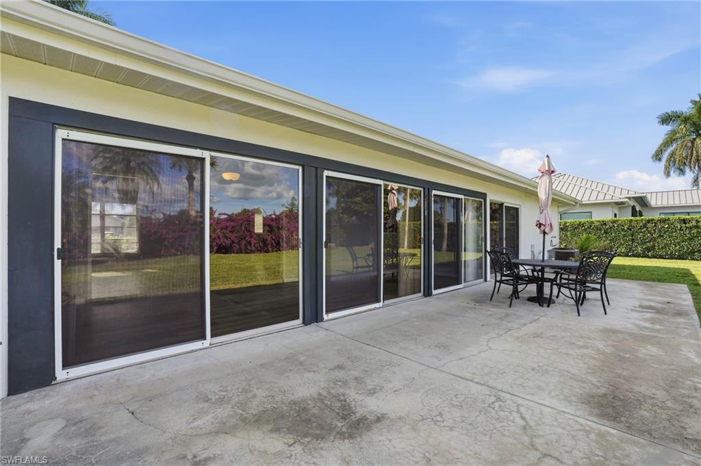 169 Viking Way Naples, FL 34110 - Photo 29 of 34 a view of outdoor space with porch and outdoor seating