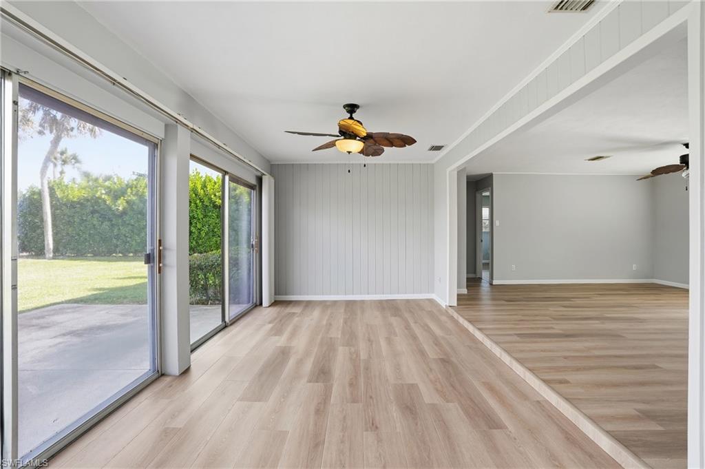 169 Viking Way Naples, FL 34110 - Photo 7 of 34 a view of empty room with wooden floor and fan