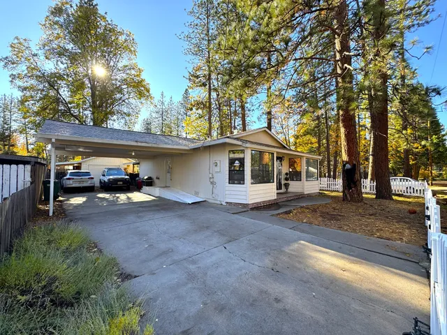 a kitchen with stainless steel appliances granite countertop a refrigerator stove top oven a sink and dishwasher