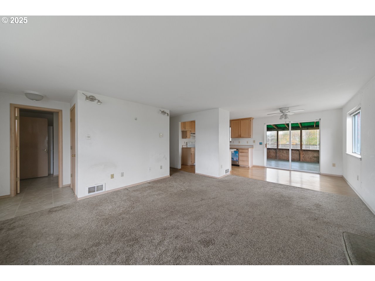 1924 Garfield Street North Bend, OR 97459 - Photo 3 of 33 a view of empty room with windows