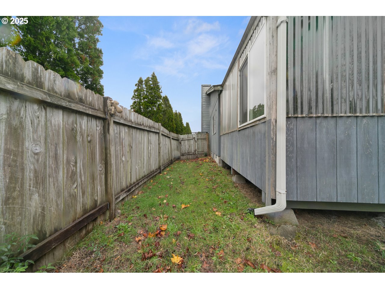 1924 Garfield Street North Bend, OR 97459 - Photo 32 of 33 a view of backyard with tub and wooden fence