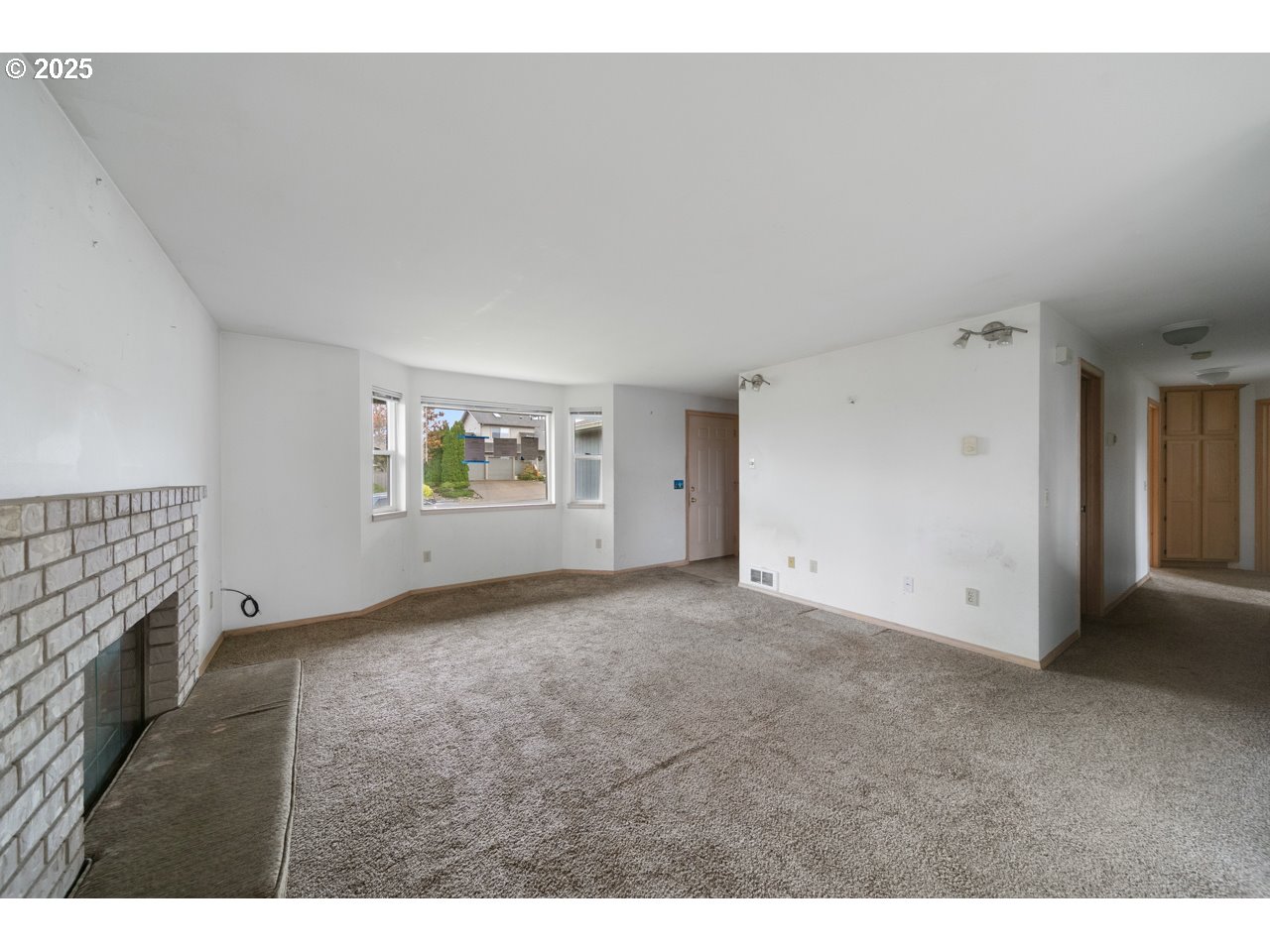 1924 Garfield Street North Bend, OR 97459 - Photo 5 of 33 a view of an empty room with a window
